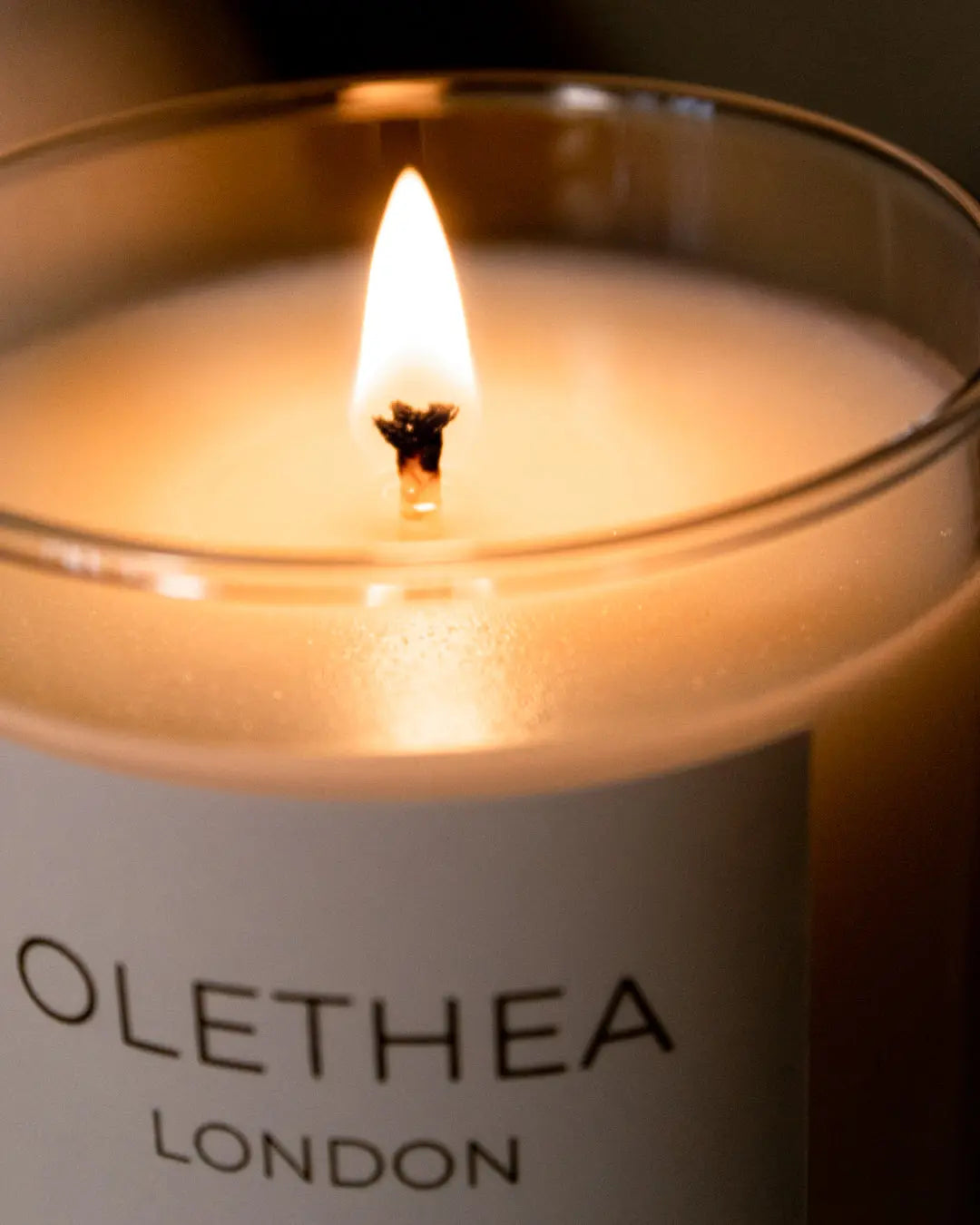 Sandalwood & Vanilla - Olethea London - close up photo of burning scented soy wax candle